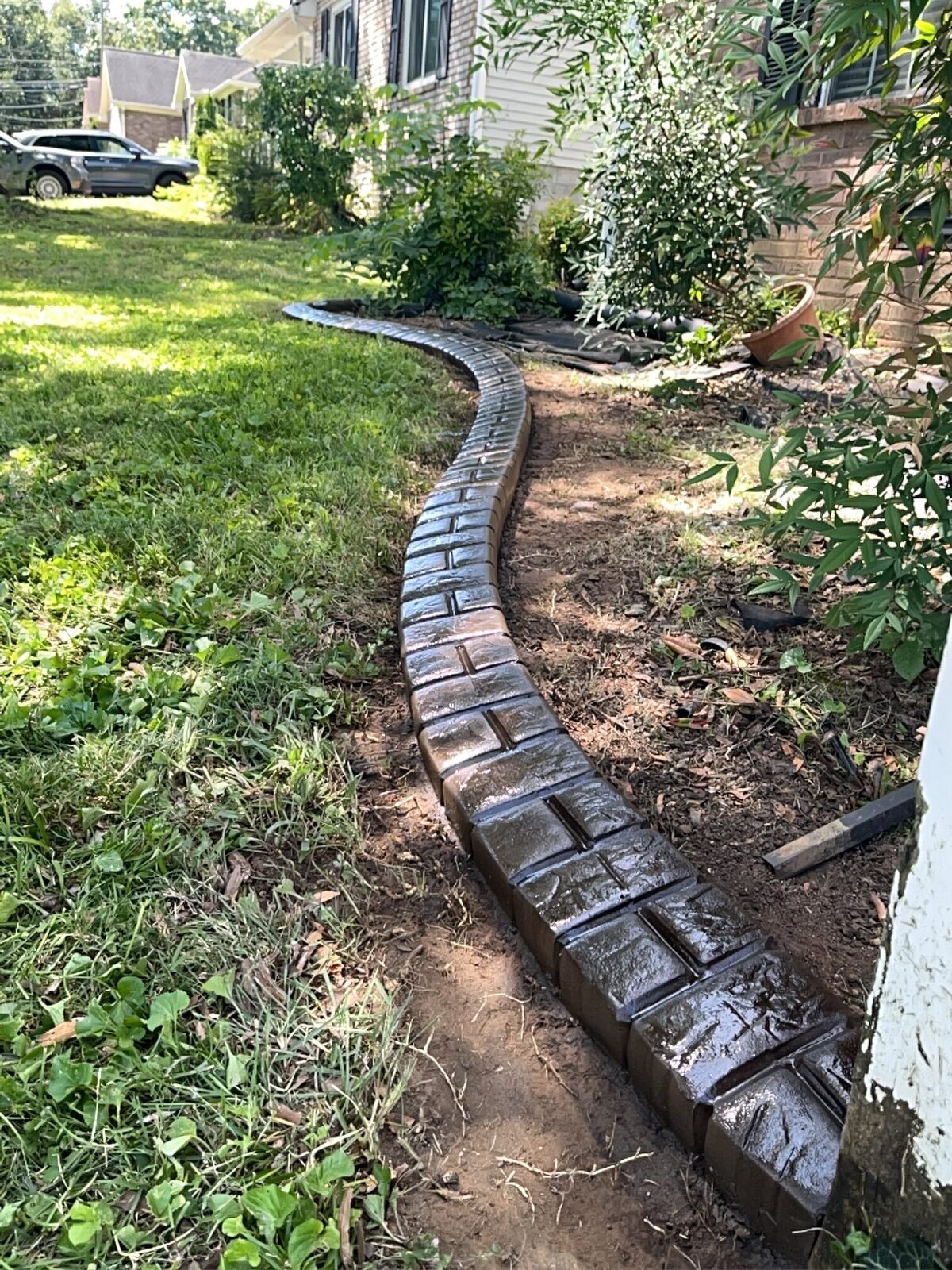 Freshly poured side-yard run, Brick Half Brick pattern