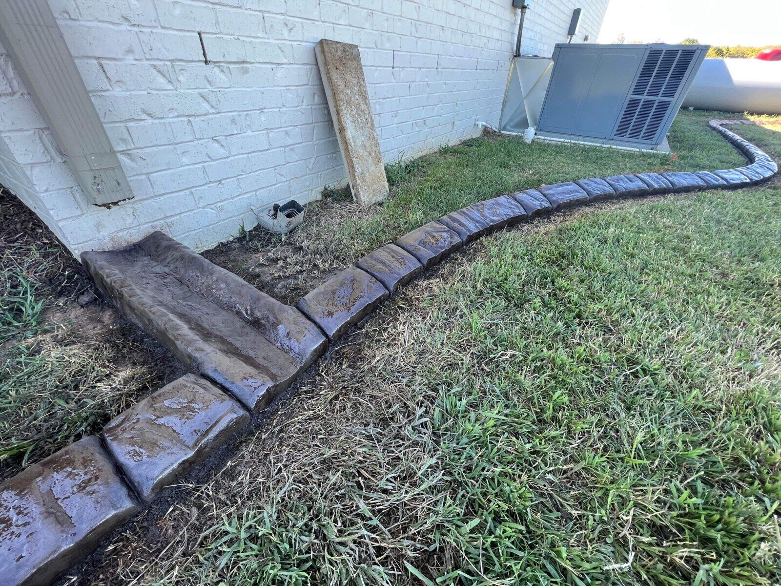 Downspout splash guard, side yard, Riverstone Splash Guard pattern