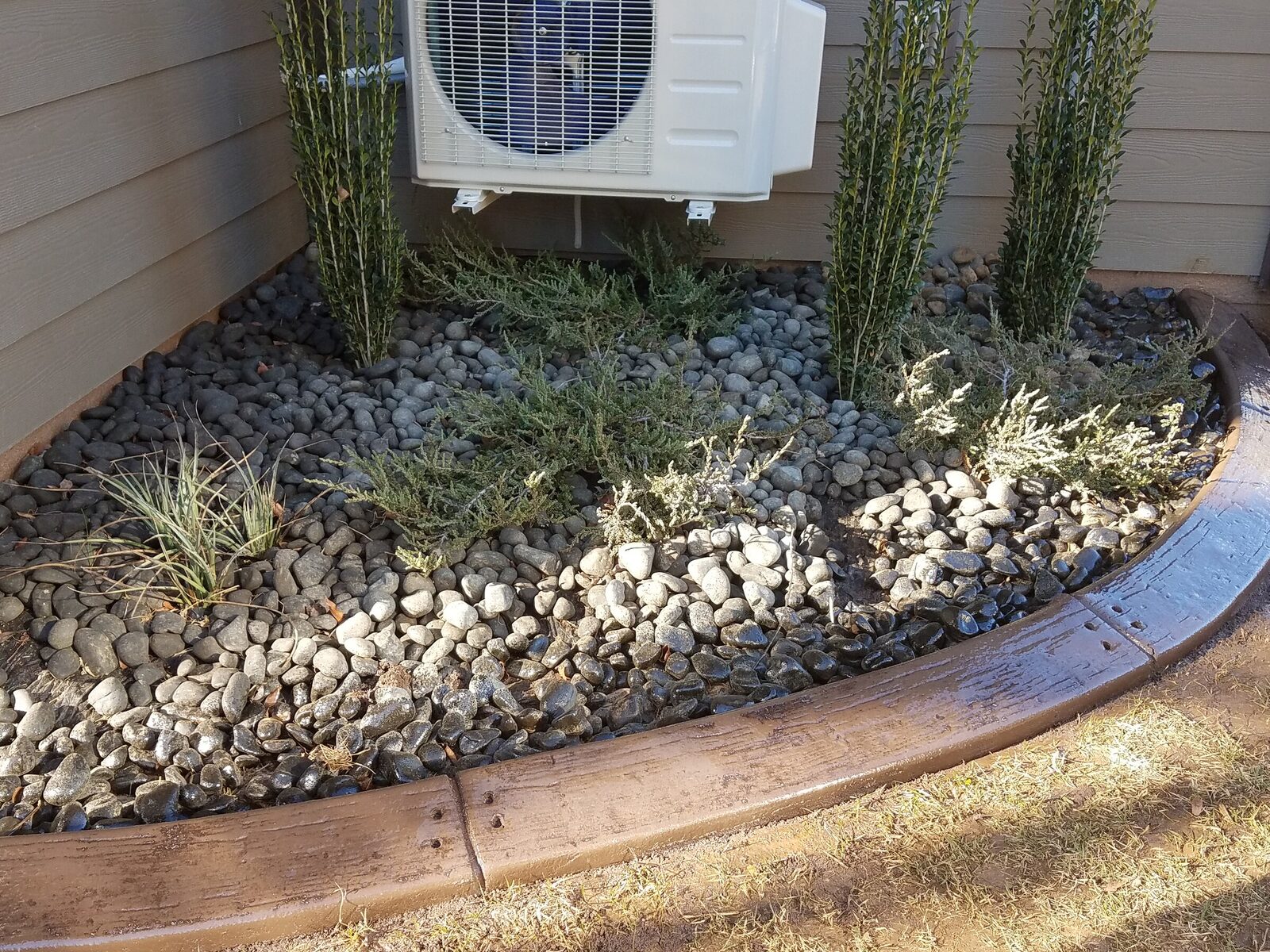 River rock along the AC pad, Woodgrain pattern