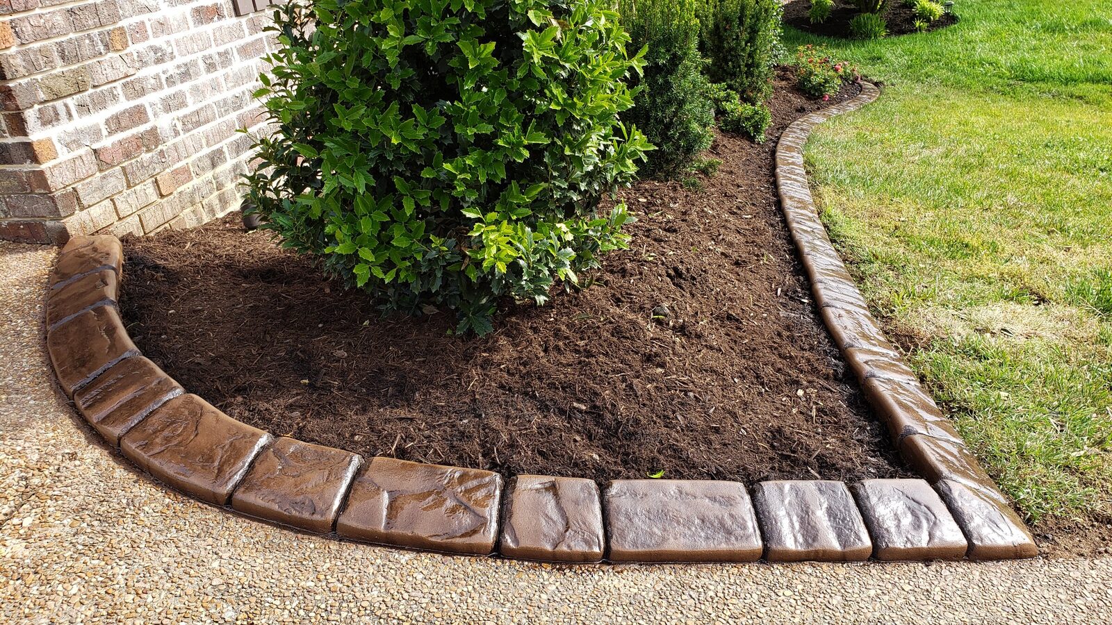 Shrub bed off the walkway, Riverstone pattern