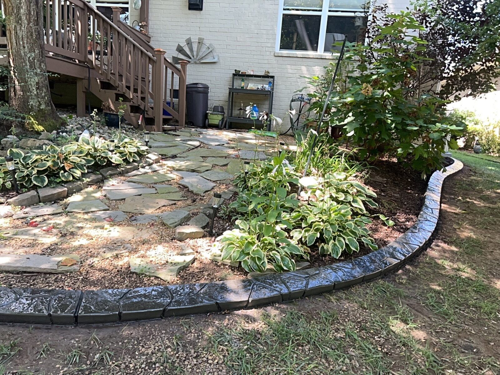 Backyard hosta bed by the deck, Random Stone pattern