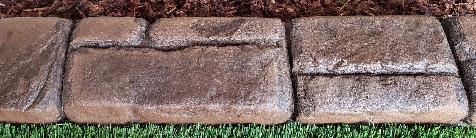 Stonehenge stamp pattern pressed into a curb