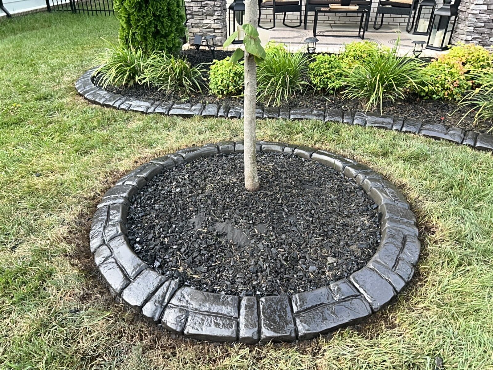 Tree ring in black lava rock, Stonehenge pattern